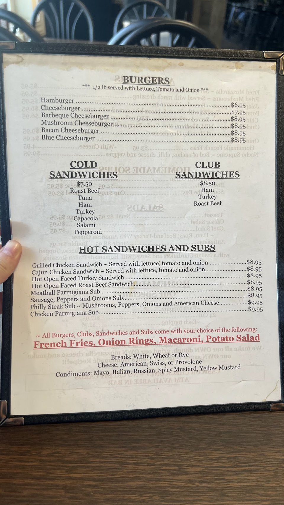 Restaurant menu featuring hot and cold sandwiches